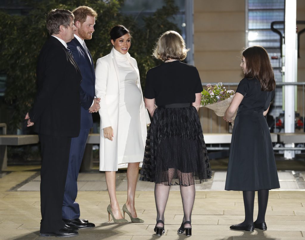 Meghan Markle and Prince Harry are greeted at the Natural History Museum on Tuesday 12th February, AP Photo by Alastair Grant.